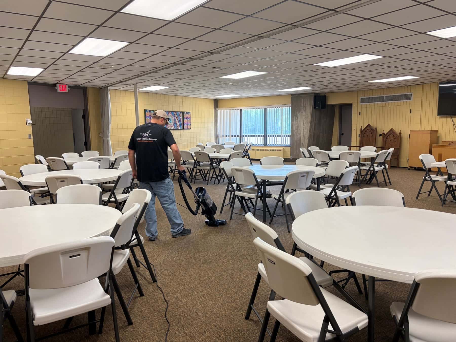 Round tables set up in a clean event space