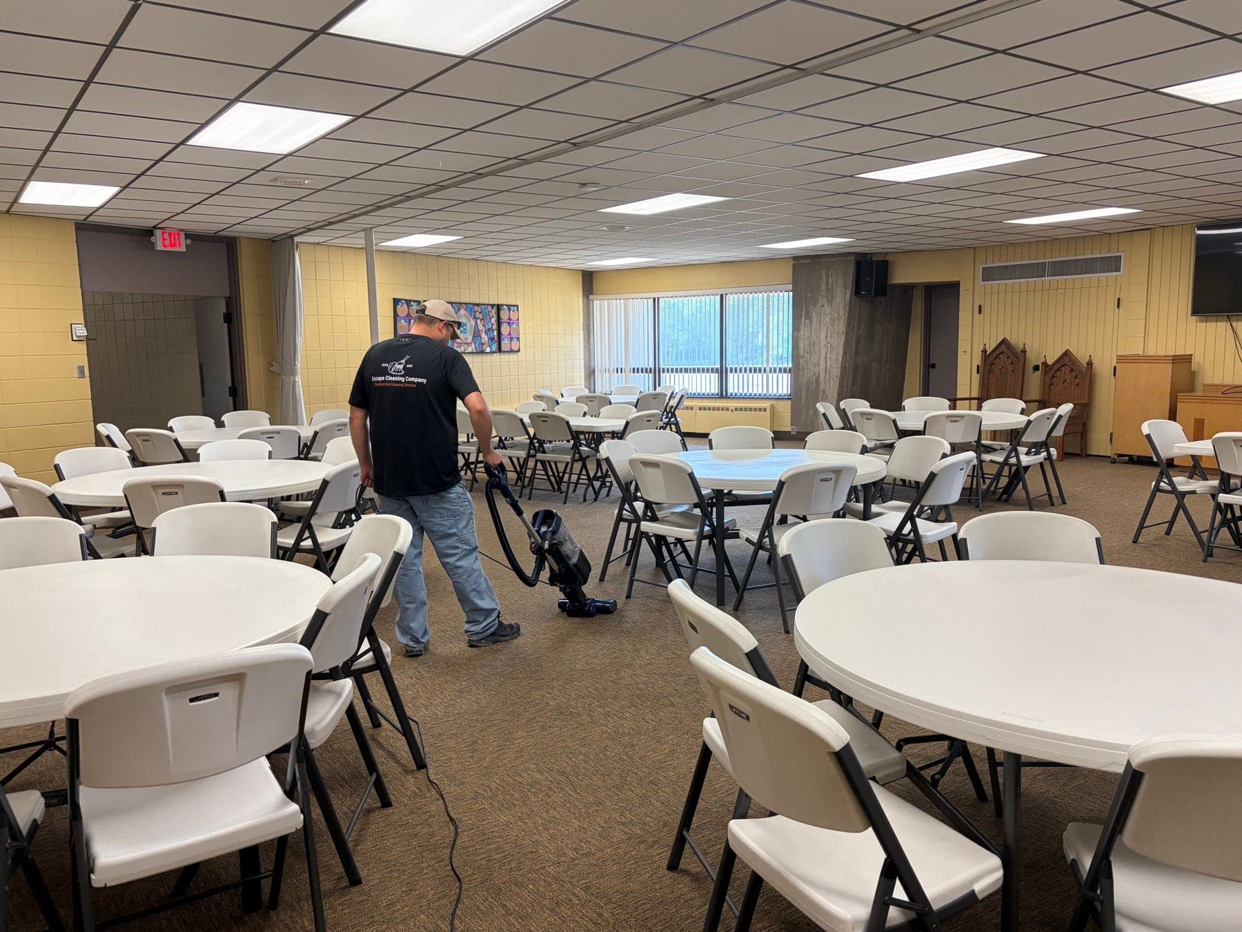 Round tables set up in a clean event space